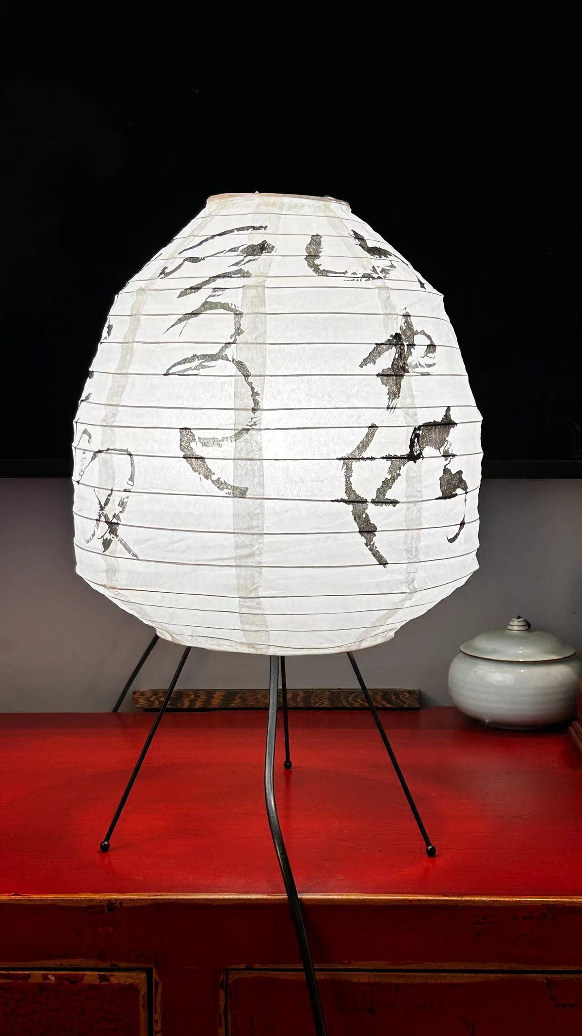 Wabi-sabi style retro rice paper table lamp with metal tripod base side view