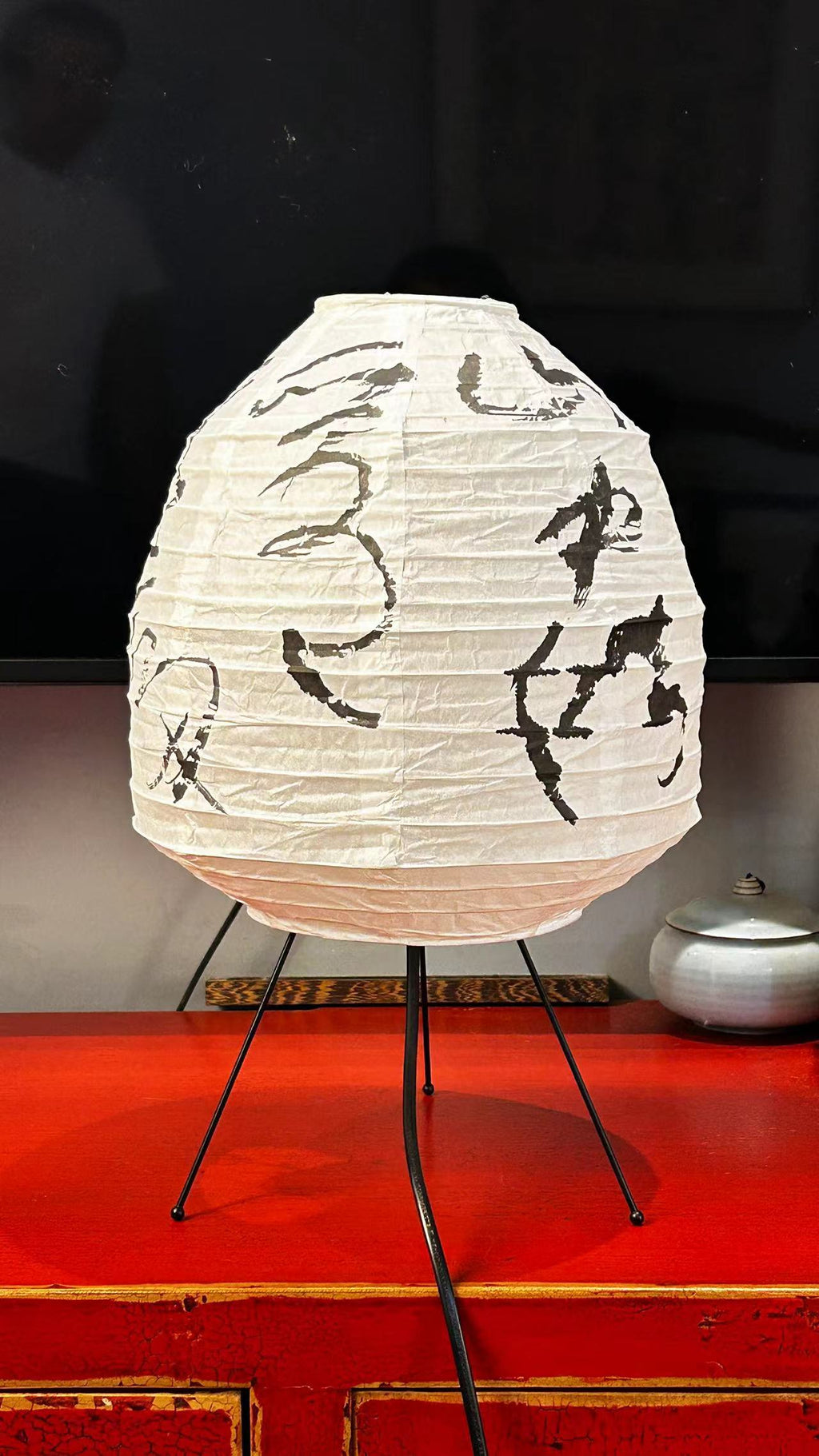 Close-up of Chinese calligraphy poetry on rice paper lantern lamp shade