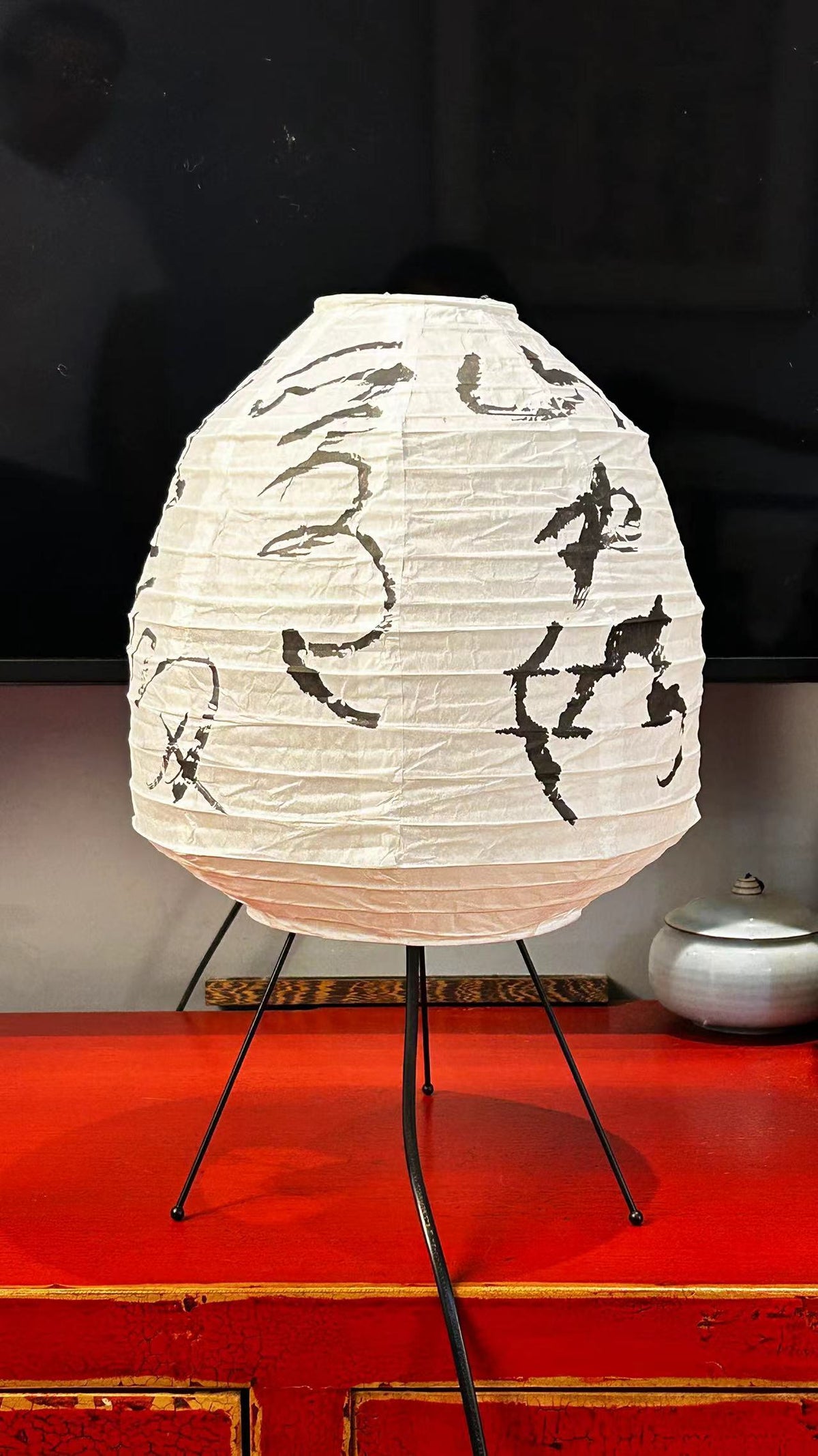 Close-up of Chinese calligraphy poetry on rice paper lantern lamp shade