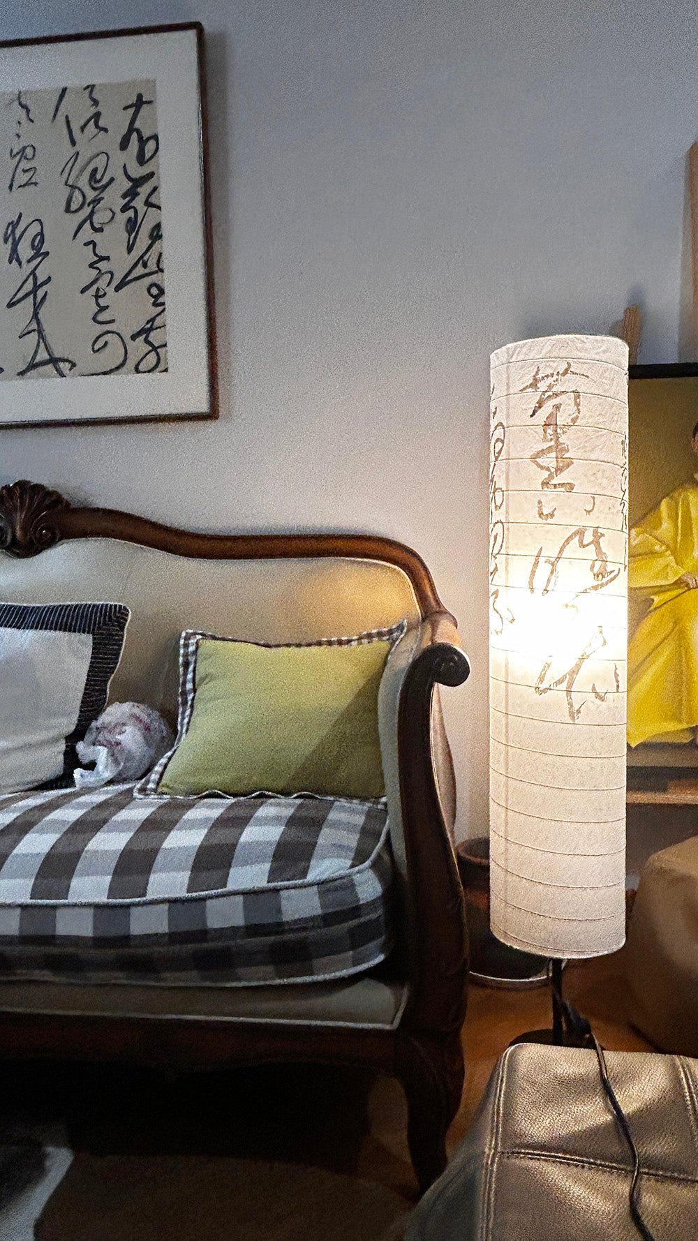 Floor lamp turned on, emitting a warm ambient glow through the rice paper.