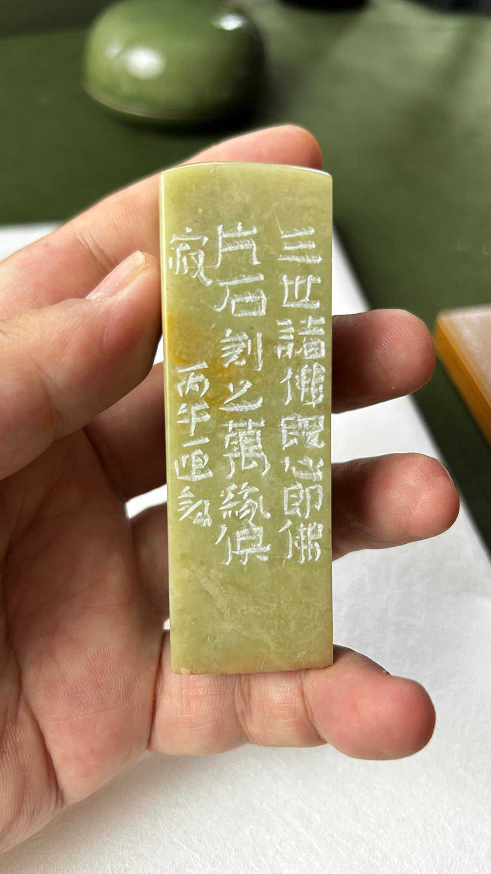 Side view of Qingtian stone seal showing full hand‑engraved calligraphy inscriptions