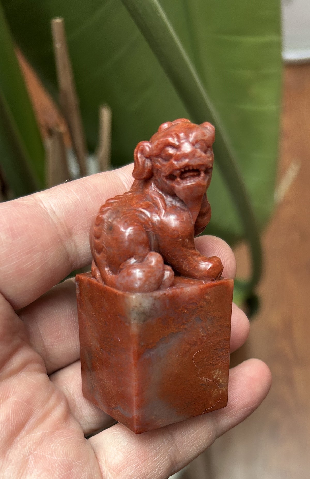Shoushan Stone square seal blank 2.3x2.3cm hand carved beast knob top view studio shot held in hand