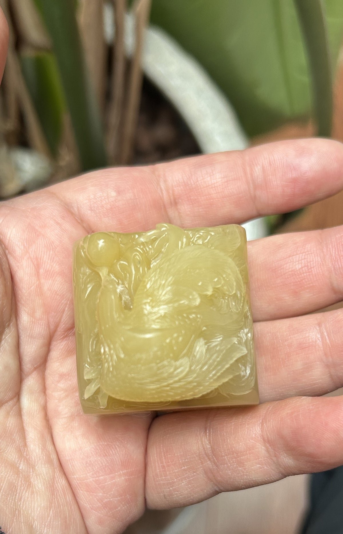 Detailed feather and cloud craftsmanship on hand-carved Laos stone phoenix seal
