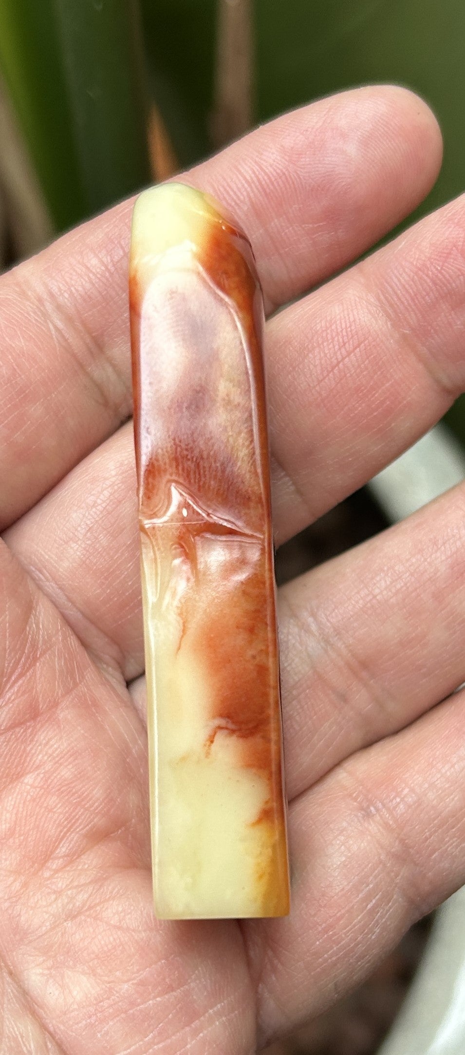 Side view of Shoushan Furong stone vertical seal with natural red and yellow color veins 